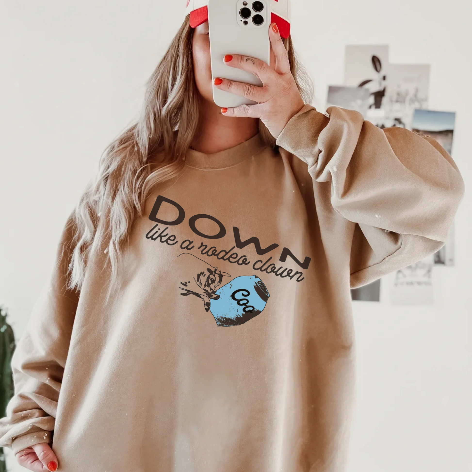 Close-up of a woman wearing Down Like a Rodeo Clown rodeo graphic on crewneck sweatshirt